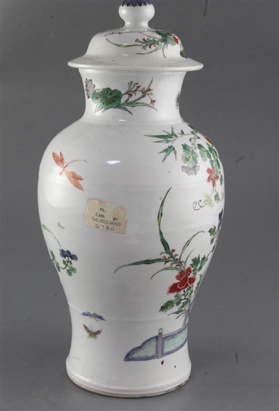 A Chinese famille verte vase and cover, late 19th century, height 37.5cm, hairline crack to rim, wood stand